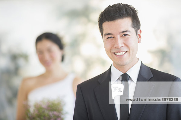 Groom smiling in wedding ceremony