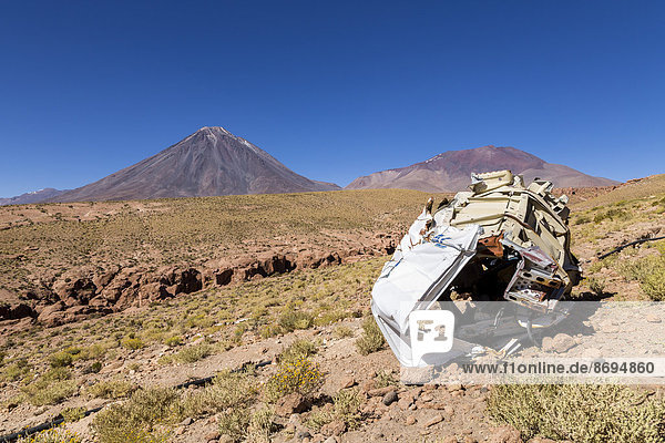 South America  Chile  Atacama Desert  Altiplano  Licancabur volcano  car wreck