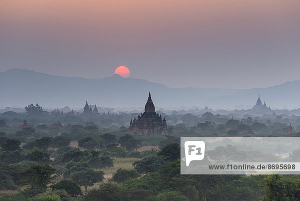 Sunset  temples  stupas and pagodas in the temple complex of the Plateau of Bagan  Mandalay Division  Myanmar or Burma