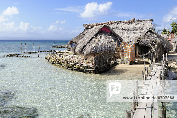 Huts on the beach  village of the Kuna people  Nalunega  San Blas Islands  Panama  Caribbean