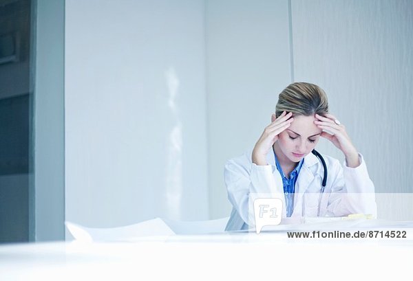 Stressed young female doctor