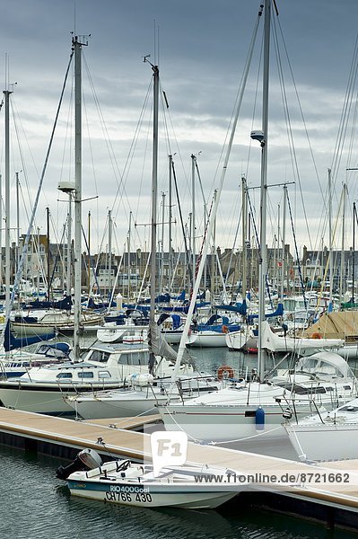 Yachts and power boats moored in the Marina at St Vaast la Hougue channel port in Normandy  France