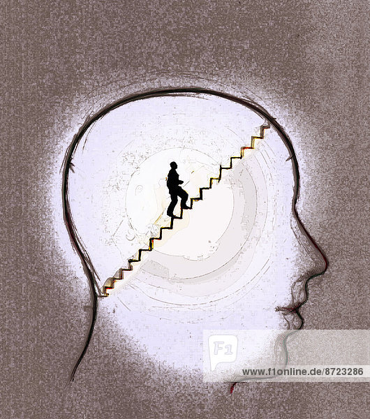 Mann geht in einem menschlichen Kopf eine Treppe hinauf