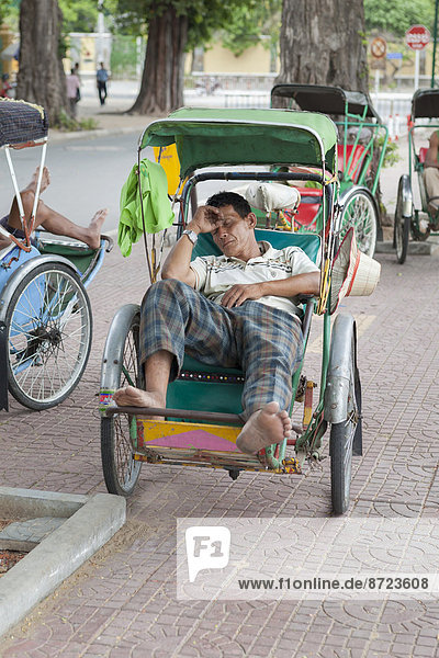 Sleeping cyclo driver  Phnom Penh  Cambodia