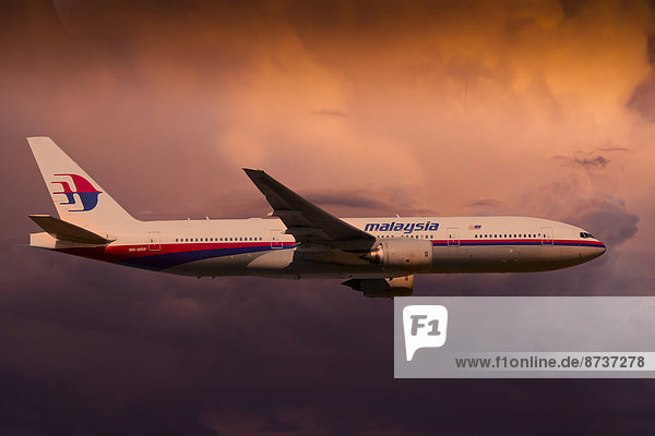 Malaysia Airlines Boeing 777-2H6ER in flight during a thunderstorm
