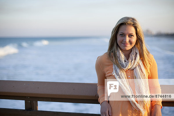 Portrait of Young Woman Standing on Pier at Beach  Jupiter  Palm Beach County  Florida  USA