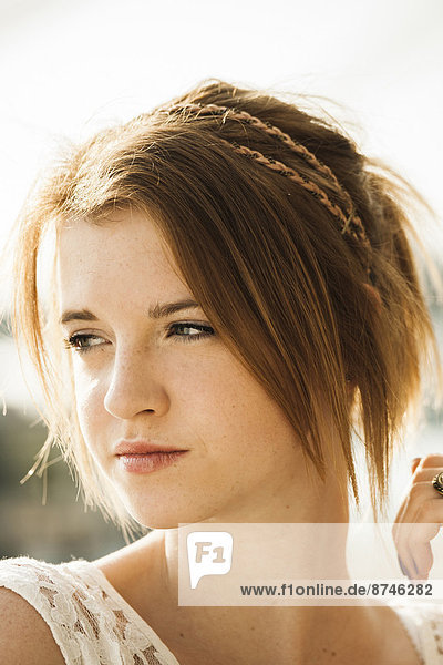 Close-up portrait of teenage girl outdoors  looking to the side
