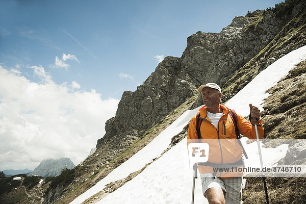 Mature man hiking in mountains  Tannheim Valley  Austria