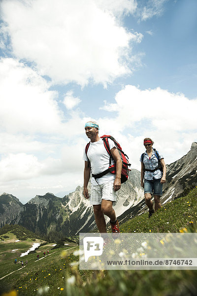 Mature couple hiking in mountains  Tannheim Valley  Austria