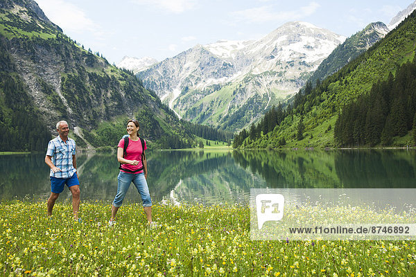 Couple Hiking by Lake  Vilsalpsee  Tannheim Valley  Tyrol  Austria