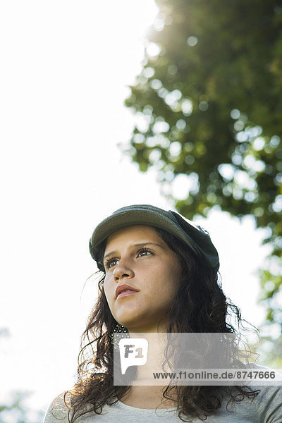 Close-up portrait of teenaged girl wearing cap outdoors  looking into the distance  Germany