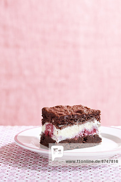 Brownie Ice Cream Sandwich with Raspberry Ice Cream  Pink Background  Studio Shot