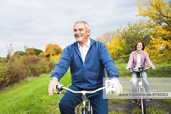 Couple Riding Bicycles in Autumn  Mannheim  Baden-Wurttemberg  Germany