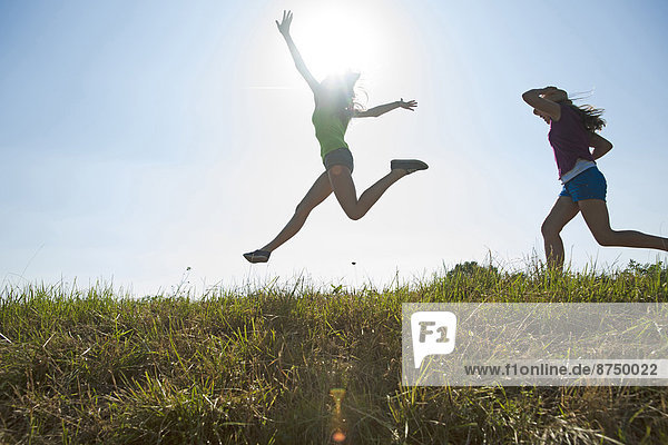 Girls Running and Jumping Outdoors  Mannheim  Baden-Wurttemberg  Germany