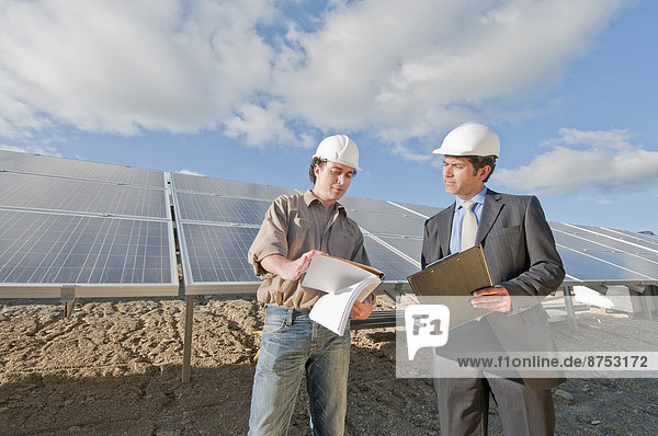 engineer and businessman in solar plant