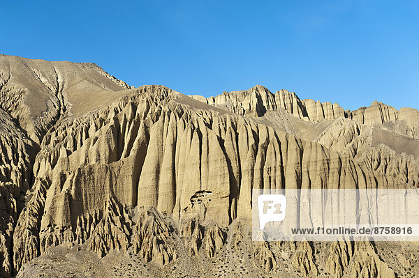 caves daytime eroded landscape Ghami Himalaya landscape mountain landscapes mountainous mountains mountains nature Nepal nobody outdoors rock formation rocks travel photography Upper Mustang