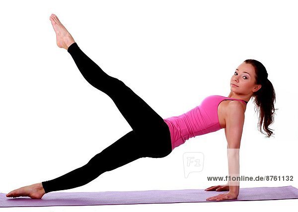 Young female model performing yoga asanas.