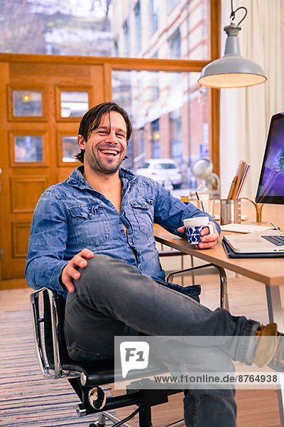Smiling man in office  Gothenburg  Sweden