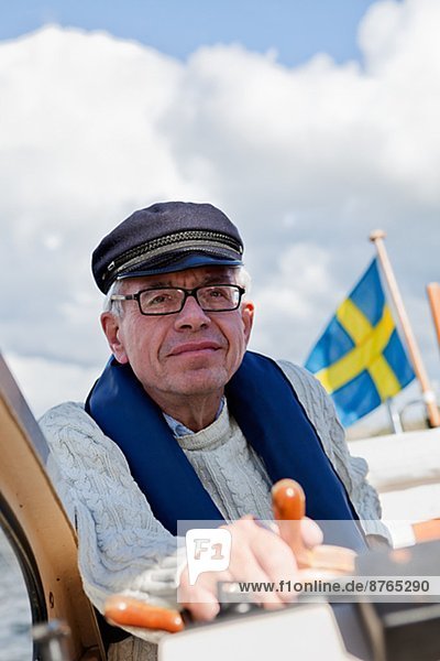 Senior man sailing  Grundsund  Bohuslan  Sweden