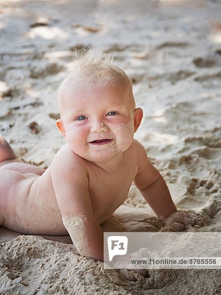 Baby on sandy beach  Thailand