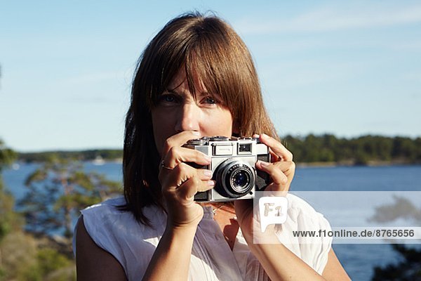 Young woman with camera  Sweden