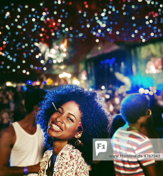 Portrait of enthusiastic woman at music festival