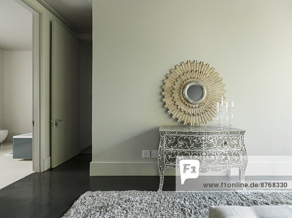 Elegant dresser and mirror in luxury bedroom