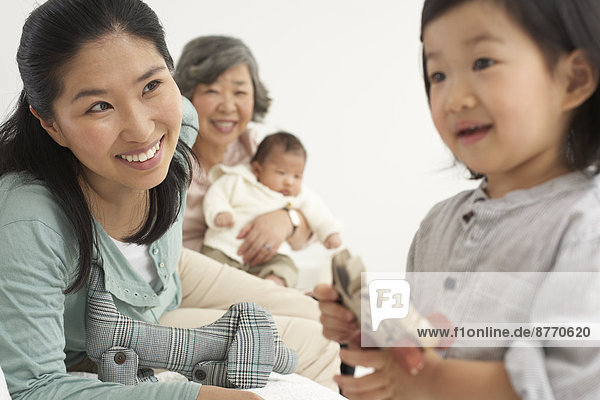 Happy Asian three generations family