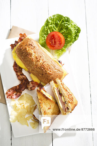 Ciabatta and sandwich with cheese  ham  bacon  tomato and salad