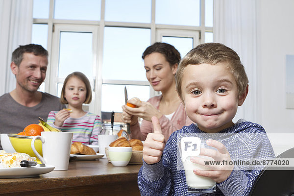 Family of four having healthy breakfast