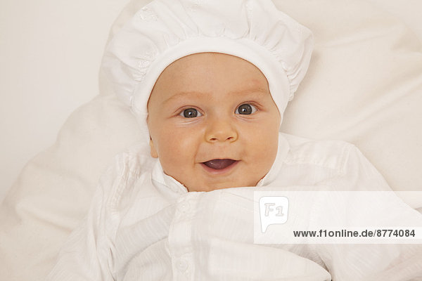 Portrait of smiling baby boy with cap