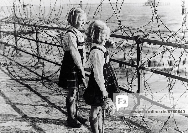 WW II  historical  war  world war  second world war  England  Two  girl  south coast  barbed wire  fence  coastal defense  1940  Nazi  National Socialist