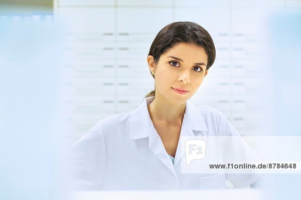 Portrait of young female pharmacist at work