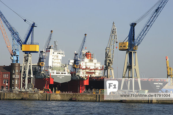 Container port  container ship  container terminal  Germany  outside  Elbe  Europe  harbour  port  harbour cranes  Hamburg  Hanseatic town  cranes  crane  loading crane  ship