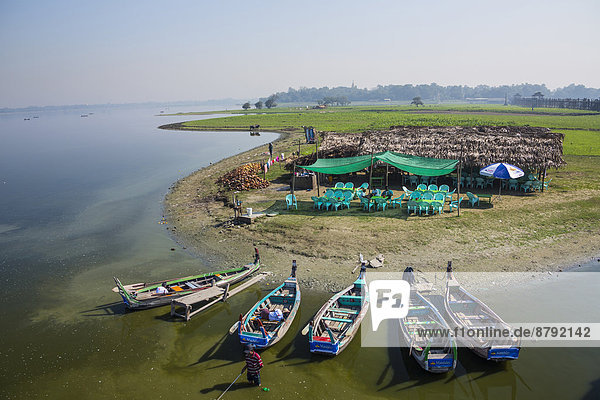 Amarapura  Mandalay  Myanmar  Burma  Asia  Thaungthaman  boats  lake  river  shop  terrace