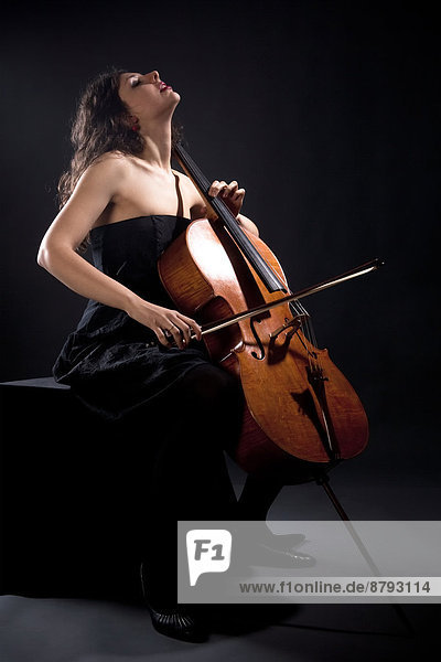 Young Woman Playing Violoncello