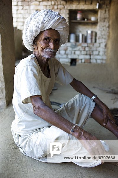 Indian man at home in Narlai village in Rajasthan  Northern India