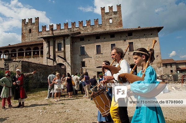 Italy  Lombardy  Malpaga  the castle  players of bagpipe and drum country fair                                                                                                                          