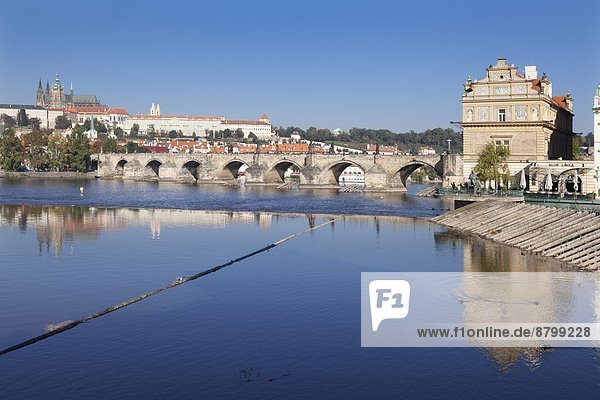 View over the River Vltava to Smetana Museum  Charles Bridge and the Castle District with St Vitus Cathedral and Royal Palace  UNESCO World Heritage Site  Prague  Bohemia  Czech Republic  Europe