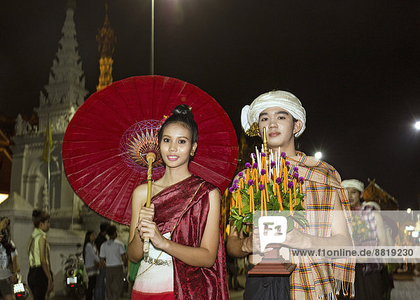Couple in traditional costume  parade  Loi Krathong Festival of Lights  Loy  Chiang Mai  Northern Thailand  Thailand