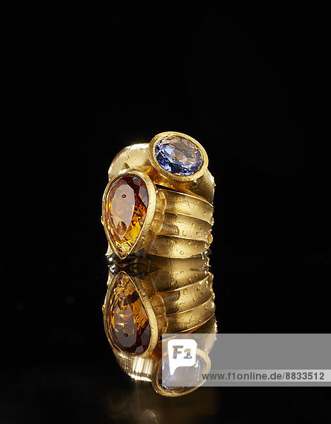 Golden ring with tanzanite and citrine