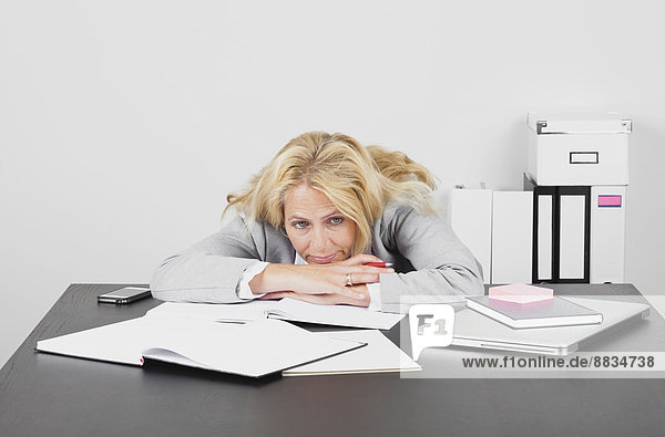Frustrated businesswoman at desk