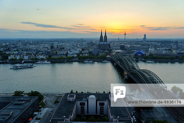 Germany  North Rhine-Westphalia  Cologne  city view with Cologne Cathedral and Hohenzollern Bridge over Rhine River