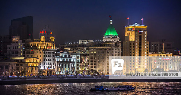 The Bund at night with the Bank of China building and the Fairmont Peace Hotel  from Pudong  Shanghai  China