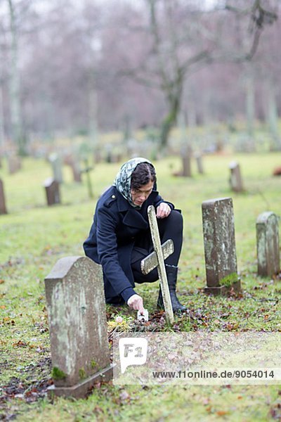 Woman on graveyard  Skogskyrkogarden. Stockholm  Sweden