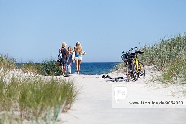 Mother with daughters looking at sea  Oland  Sweden