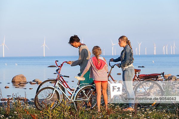 Mother with daughters cycling  Oland  Sweden