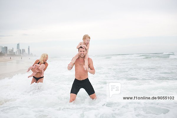 Family with children on beach  Australia
