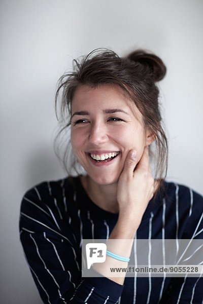 Portrait of smiling young woman  studio shot