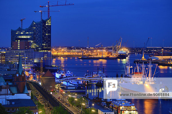 Elbe River with the museum ship Cap San Diego and Elbe Philharmonic Hall  at dusk  Hamburg  Germany